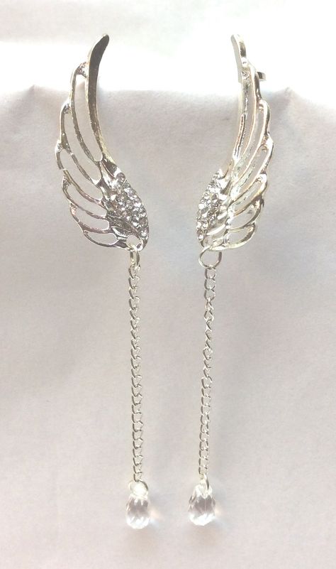 "Elegant, Beautiful Earrings, Dangle Style. All Occasion Piece, Very Exquisite Long Dangle Angel Wings Design with Rhinestone Accents and Chain. Ear cuff at top to hold them in place. Silver Tone. Approx. Size 4\" long" Angel Wing Accessories, Angel Wing Jewelry, Angelic Accessories, Angel Wedding, Wings Jewelry, Angel Accessories, Wedding Angels, Earrings Bride, Angel Wings Design