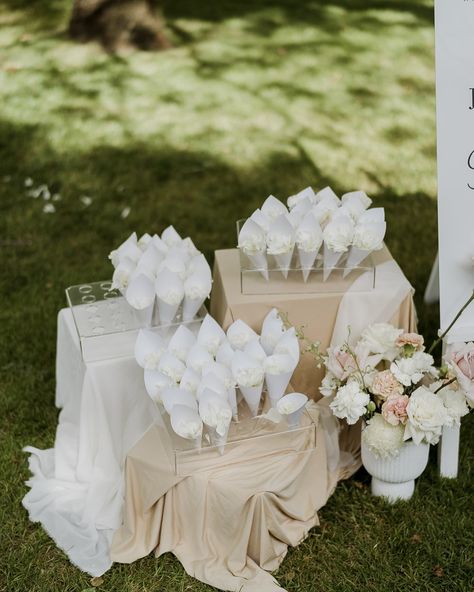 That petal toss moment after you say ‘I do’ is so iconic! We offer petal stations that sit perfectly next to your welcome sign to greet guests as they enter your ceremony space. The cones come in lots of 25- so you can choose how many you think you’ll need! Or maybe you don’t need any cones! You just want a big ol’ basket of delicate petals that guests can grab from- we can do that too! We can clean up the beautiful mess afterwards too 😉 Photography by @anelloweddings ✨ Toss Petals Wedding, Flower Petals Thrown At Wedding, Pedal Toss Wedding, Flower Toss Wedding, Petal Station, Petal Toss Wedding, Flower Toss, Petal Toss, Your Welcome