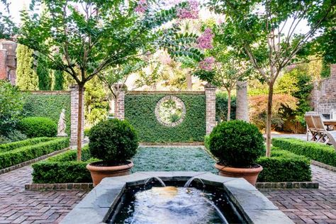 This formal garden defined by brick paths, statuary and classic Southern plants, is an oasis in the heart of Charleston, South Carolina. Italian Cypress Trees, Landscaping Shrubs, Brick Archway, Charleston Gardens, Brick Pathway, Formal Garden, Walled Garden, Garden Pictures, Charming Garden