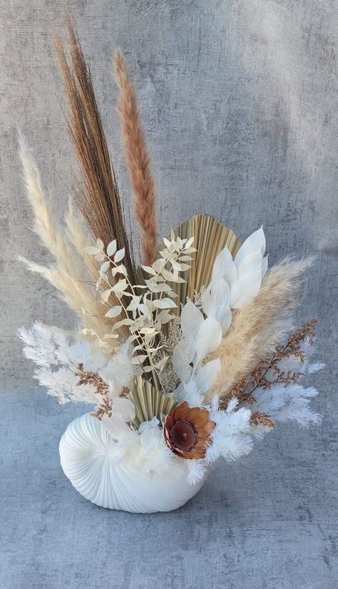 Beautiful coastal style dried and preserved floral arrangement in nautilus shell pot Nautilus Shell, How To Preserve Flowers, Coastal Style, Floral Arrangements, Flower Arrangements, Floral, Flowers