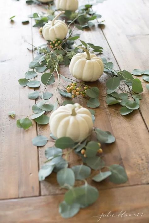 Get the step-by-step details for this easy and inexpensive Thanksgiving centerpiece. This pretty mini pumpkin table runner was just $15! Thanksgiving Table Crafts, Thanksgiving Entertaining, Craft Table Diy, Pumpkin Table Runner, Neutral Green, Julie Blanner, Thanksgiving Dinner Table, Tafel Decor, Thanksgiving Table Settings