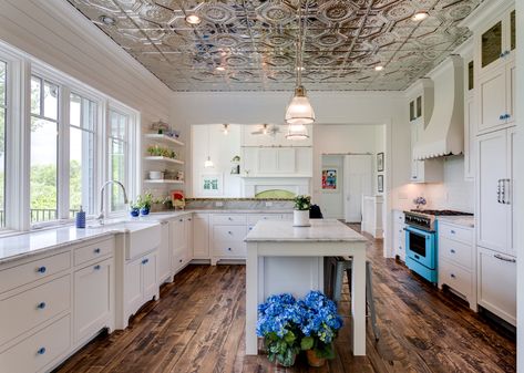 A new generation of DIY designers still love the farmhouse look but they want a more authentic approach. Here's what you need to know about how farmhouse style has changed. Metal Tin Ceiling, Tin Ceiling Backsplash, Travertine Floor Tile, American Tin Ceiling, Tin Ceilings, Tin Tiles, Rock Fireplaces, Large Centerpiece, Tin Ceiling Tiles