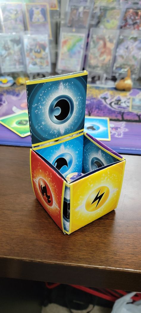 Crafts With Pokemon Cards, Upcycle Pokemon Cards, Pokemon Energy Cards Craft, Pokemon Card Crafts, Pokémon Nursery, Pokemon Energy Cards, Pokemon Card Box, Pokémon Crafts, Mystery Box Ideas