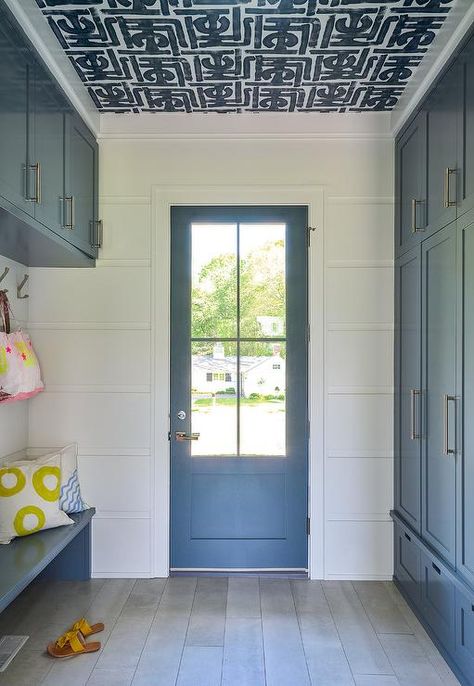 White and Blue Mudroom with Black and White Wallpaper on Ceiling - Transitional - Laundry Room Blue And White Laundry Room, Blue Beadboard, Beadboard Trim, Mudroom Storage Bench, Transitional Laundry Room, Blue Shelves, Built In Lockers, Slate Tile Floor, Mudroom Cabinets