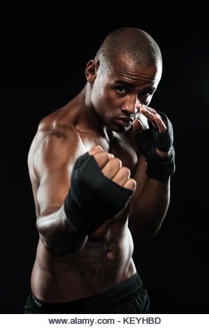 Portrait of afroamerican boxer posing in boxing bandage over black background, ready to fight - Stock Image Boxing Poses Reference Male, Boxing Poses Reference, Boxer Reference, Boxer Stance Reference, Refrence Pose Boxing, Fighter Photography, Boxer Pose, Boxing Reference, Chef Arnold