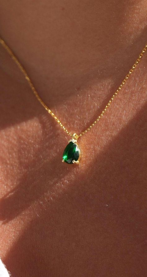 Elevate your elegance with our Emerald Pendant Necklace, featuring a genuine green emerald, perfect for those born in May. This exquisite necklace showcases a tiny teardrop-shaped emerald pendant, set delicately on a dainty chain. Chain Length: 16+2". Key Features: Genuine Green Emerald: Authentic, vibrant green emeralds for a stunning appearance. Teardrop Pendant: A petite pear-shaped emerald adds a touch of grace. May Birthstone: Celebrate your birth month or give a meaningful gift. Dainty Design: Perfect for everyday wear or special occasions. Material: High-quality, 925 Solid Sterling Silver over 14k gold plated or silver.  that ensure long-lasting wear. Emerald Jewelry Aesthetic, Gold And Green Jewelry, Emerald Gold Jewelry, Emerald Jewelry Necklace, Emerald Pendant Set, Emerald Necklace Gold, Gold Emerald Necklace, Emerald Necklaces, Emerald Pendant Necklace