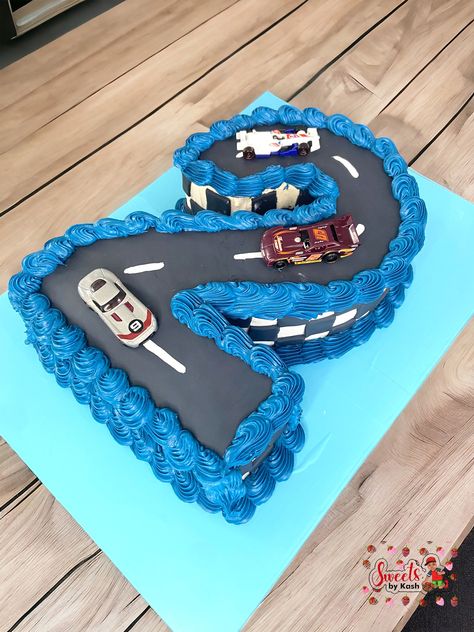 2 FAST 2 FURIOUS... 🏎 Our number cakes are the perfect way to celebrate milestones and the customizations are endless. Choose your number, color and theme and let us do the rest! Opt for something different this year and wow your guests with a cake that stands out and above from the rest. #viral #explore #creativity #cake #edibleart #cakesofinstagram #cakeart #chicagobaker #sweetsbykash #thecakelady #numbercake #racing #celebrate #milestones #numbersense 2 Fast 2 Furious Cake, Blue Car Cake, 2 Fast 2 Furious Birthday Cake, Fast And Furious Cake Ideas, Two Fast Cake, 2 Fast 2 Furious, Fast 2 Furious, Number Cakes, Edible Art