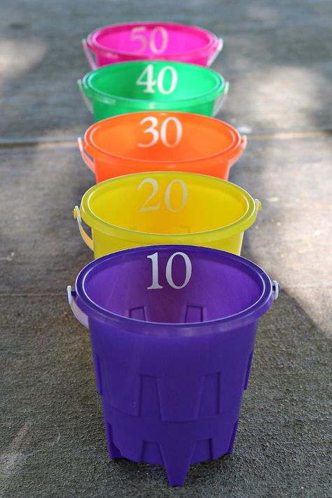 Bucket Ball Toss – you will need 5 buckets, 3 soft balls, and sticky numbers. I used my vinyl cutter to make numbers for each bucket, you could also use sticky letters. Cost – $6 Outside Games, Outdoor Games For Kids, Water Games, Water Party, Carnival Birthday, Backyard Games, Summer Games, Carnival Games, Kids Party Games