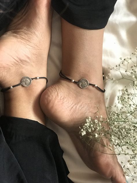 These nazariya anklet pair is a beautiful piece of jewelry complete with silver coins and beads attached to black thread. Thread Anklets, Silver Aesthetic, Anklet Designs, Jewelry Black, Handmade Jewelry Designs, Black Thread, Silver Coin, Silver Coins, Jewelry Designs