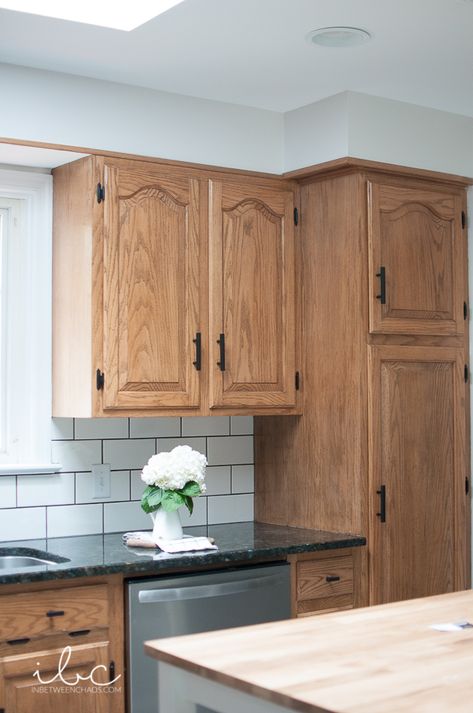 Briwax Honey Oak Cabinets, Oak Cabinets With Vinyl Plank Flooring, Woodgrain Cabinets Kitchen, Blue Gray Kitchen Walls Oak Cabinets, Black White Tan Kitchen Ideas, Best Hardware For Oak Cabinets, How To Paint Oak Kitchen Cabinets, Briwax Cabinets, How To Make Oak Cabinets Look Modern