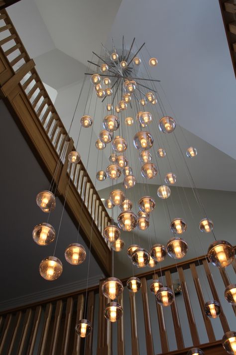 A stunning custom Bocci 14.81 chandelier with spreader bars Shanderlear Lights, Stair Case Wall Design, Large Chandelier High Ceilings, Staircase Pendant Lighting, Lobby Lighting, Chandelier Living Room Modern, Design My Kitchen, Staircase Wall Decor, Stair Lights