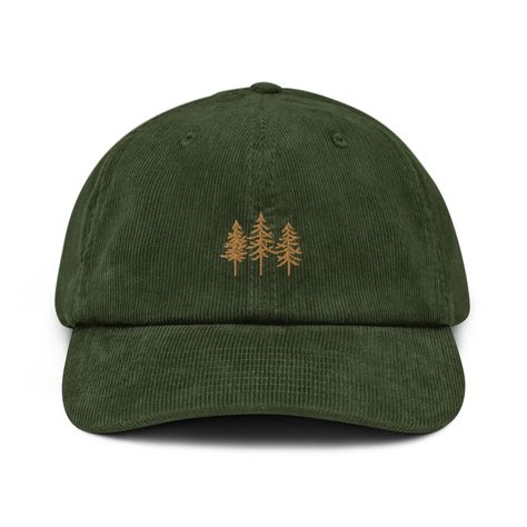 This Pine Trees Corduroy Hat is absolutely perfect for pairing with a flannel, sweatshirt, or pretty much anything really! It's the perfect hat to wear while going camping, hiking, or even a great gift to give to your natural loving friend or significant other.  * 100% cotton corduroy * Soft, unstructured crown * Cotton twill sweatband and taping * Adjustable buckle * Blank product sourced from China Camping Hat, Embroidered Corduroy, Hat Aesthetic, Corduroy Hat, Cadeau Parents, Hat Embroidery, Corduroy Fabric, Embroidered Hats, Dad Caps