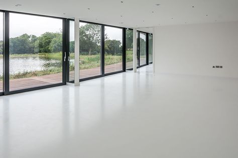 Installation Date: April 2016 Location: Kent Flooring Type: Resin Floor Flooring Colour: White 350m2 rubber crumb base and poured resin finished in white. Two kitchens, WC, Hallway and corridors, lounge, T.V. room, bedroom, dressing room and two staircases. A water based underfloor heating system was also installed. White Painted Floors, Micro Concrete, Space Installation, Resin Floor, Golf Room, White Wall Bedroom, Concrete Flooring, Living Room Tiles, Concrete Kitchen