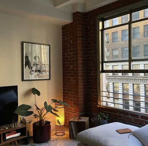 Messy New York Apartment, Loft Apartment Spiral Staircase, Sophia Kelly Apartment, Nyc Brick Apartment Aesthetic, Apartment Aesthetic Los Angeles, Nyc Brick Apartment, Brick Wall Apartment Aesthetic, Men’s Apartment Aesthetic, Cool Apartment Aesthetic