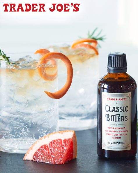 Trader Joe's Classic Bitters; shown poured on top of two glasses of sparkling water, with sprig of rosemary and orange twist garnishes Trader Joes Alcohol Drinks, Trader Joes Meal Planning, Flavored Sparkling Water, Trader Joes Recipes, Orange Twist, The Dash, Trader Joe’s, Trader Joe, Trader Joe's