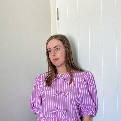 Becky ✿ on Instagram: "My Ganni dupe (using the #sagebrushtop) with beautiful crisp Frankie bubblegum & white stripe cotton from @thefineclothcompany 💅🏼💗🎀💖 this fabric has been such a dream to sew and the colour is just perfect!!! Such a fun make and I know having this blouse in a pop of colour is going to be such a well-worn addition to my wardrobe! In my husband’s words when I showed him: “I’m so glad I get to see that top in a colourful fabric!” Also very glad I gave it nice ‘guts’ as they say, by binding the inner seam where the ruffle joins. Topped off with my fave bee 🐝 tags made from cotton tape I found at a fabric store a few years ago! #gannidupe #gannitop" Ganni Blouse Sewing Pattern, Ganni Top Sewing Pattern, Bee Tags, Pattern Hack, Blouse Pattern Sewing, Top Sewing Pattern, New Start, My Wardrobe, Fabric Store