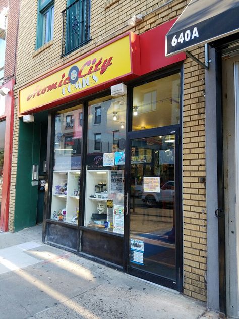 The exterior of Atomic City Comics on South Street near its intersection with 7th Street in downtown Philadelphia. The comic book store offers a small cafe area (serving only cold bottles of soft drinks and water), several arcade games, and hosts movie and comic book events regularly. It also has the largest selection of manga (Japanese comics) in downtown Philadelphia. Arcade Exterior, Korean City, Store Exterior, Downtown Philadelphia, Cafe Area, South Street, Comic Book Shop, Book Shops, Comic Book Store