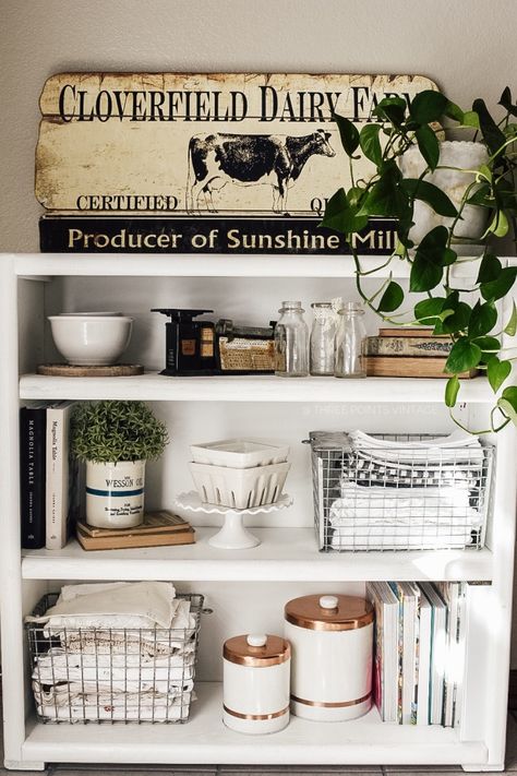 Kitchen Bookcase Decor, Kitchen Shelf Styling Vintage, Styling Kitchen Bookshelves, Kitchen Bookshelves Ideas, Bookshelf In The Kitchen, Kitchen Bookcase Styling, Kitchen Cookbook Shelves, Open Cabinet Decor Kitchen, Kitchen Bookshelf Styling