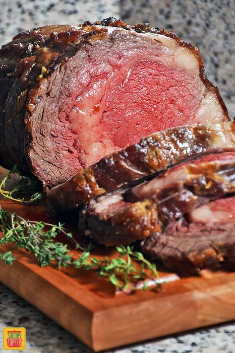 Our Slow Roasted Prime Rib recipe is a MUST-MAKE holiday favorite! Prime rib rubbed with a garlic and herb paste slow roasted to seal in all the juices with a reverse sear to ensure a crisp crust on the outside for maximum flavor. Adorn your Christmas table with a beautiful SLOW ROASTED PRIME RIB centerpiece. An impressive holiday dinner that's so easy to make cooks to perfection every time! #SundaySupper #roastperfect #christmasdinner #easyrecipe #holidaydinner #primerib #beefroast Best Prime Rib Recipe, Roasted Prime Rib, Slow Roasted Prime Rib, Prime Rib Roast Recipe, Ribeye Roast, Cooking Prime Rib, Boneless Ribs, Sirloin Tip Roast, Rib Roast Recipe