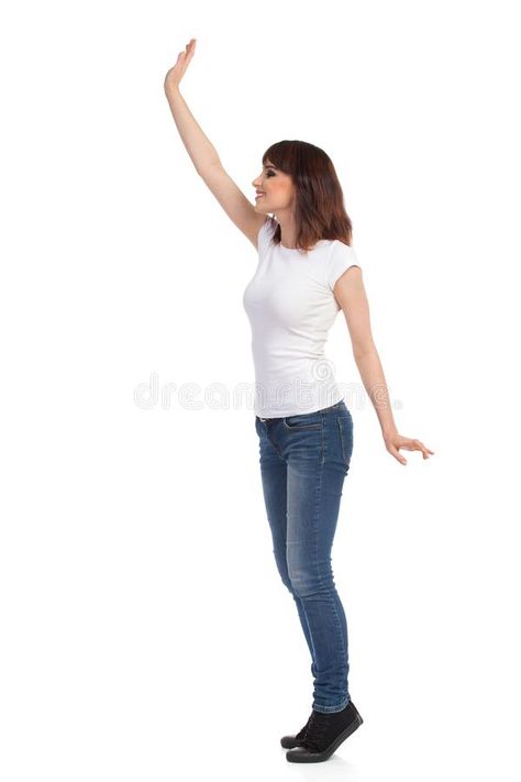 Young Woman In White T-shirt And Jeans Is Standing TipToe And Waving Hand. Side View. Stock Photo - Image of length, enjoy: 102997358 Waving Hand Pose Reference, Hand Side View, Waving Hand, Walking Poses, Woman In White, People Poses, Anatomy Poses, Hand Reference, Standing Poses