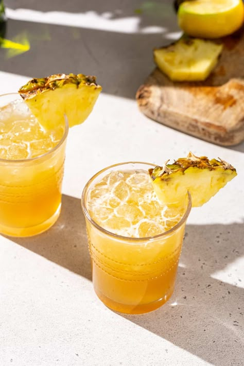 The Pineapple Whiskey Sour is a simple and absolutely delicious whiskey drink, and it’s perfect for summer sipping! This refreshing cocktail combines pineapple and lemon juices with a blended whiskey for a tasty combination of tropical and warm flavors. A touch of maple syrup balances out the tartness perfectly. This is such a great summer cocktail, perfect for sipping by the pool or for a hot afternoon happy hour! Pineapple Cocktail Drinks, Pineapple Whiskey Sour, Sweet Whiskey Cocktails, Mango Juice Cocktail, Pineapple Juice Cocktails, Pineapple Sour, Pineapple Cocktail Recipes, Pineapple Cocktails, Maple Cocktail