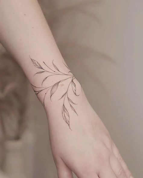 54 Bracelet Tattoos That Are Better Than Jewelry - Our Mindful Life Tattoo Wrap Around Wrist, Straight Line Tattoo, Bracelet Tattoo For Man, Wrap Around Wrist Tattoos, Bracelet Tattoos, Small Symbol Tattoos, Wrist Bracelet Tattoo, Wrap Around Tattoo, Wrap Tattoo