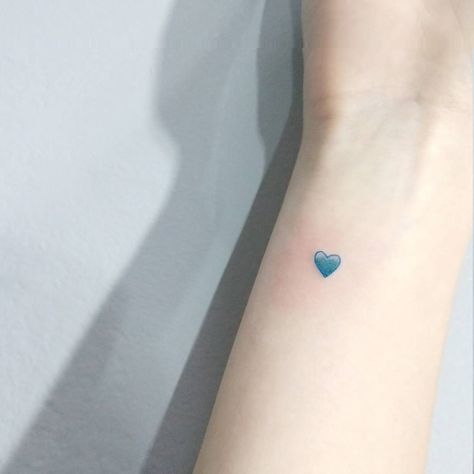 19 Tiny Tattoos To Get In An Unexpected Place Blue Heart Tattoo, Blue Ink Tattoos, Heart Tattoo Wrist, Red Heart Tattoos, Tiny Heart Tattoos, Heart Temporary Tattoos, Small Heart Tattoos, Meaningful Tattoos For Women, Blue Tattoo