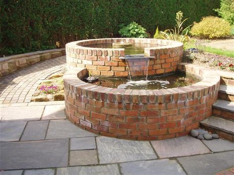 Brick Pond Ideas, Water Body Landscape Design Garden Ponds, Brick Waterfall, Brick Pond, Brick Pond Raised, Low Maintenance Garden Ideas, Mill Stone Water Feature, Raised Pond, Low Maintenance Garden Design