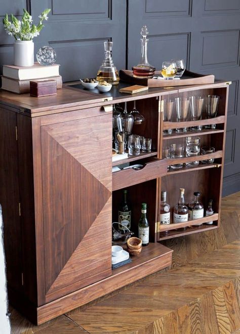 We’ve scoured the Internet and found some of the chicest bar cabinets around. Whether you fit them inside your finished basement, dining room, or a hosting area that you’re lucky enough to have a part of your open kitchen, these designs will have you planning extra dinner parties by the weekend. And don’t worry, there […] The post 15 Bar Cabinets That Will Have You Planning Dinner Parties By The Weekend appeared first on Trendir. Small Bar Cabinet, Bar Furniture For Sale, Bar Cabinet Design, Home Bar Cabinet, Bar Cabinets, Modern Home Bar, Bar In Casa, Home Bar Design, Diy Home Bar