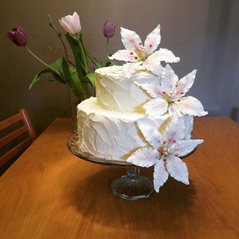 Stargazer lily cake that I made for my birthday! Buttercream and gum paste lilys. Lily Cake, Lily Wedding, Ruffle Cake, Stargazer Lily, 1st Communion, Dream Wedding Venues, Wedding 2025, Pretty Birthday Cakes, Just Cakes