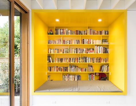 A Bright Yellow Reading Nook Steals the Show in This Energy-Efficient Portland Abode - Dwell Yellow Bookshelves, Living Photo, Room Shelves, Living Room Shelves, Modern Barn, Built In Desk, Eco Friendly House, Home Library, Architect Design