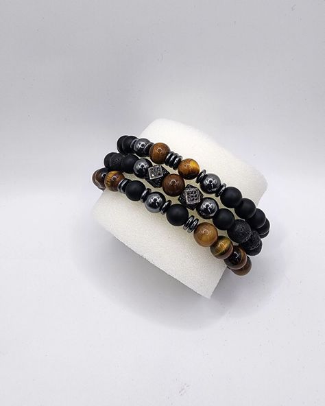 Onyx is known for its protective and grounding benefits while tiger eye beads are believed to bring balance and good fortune. Together, they create a harmonious blend of style and meaning, ideal for the modern man who values both aesthetics and symbolism. # OnyxBeadBracelet #fathersdaygifts #TigerEyeBead #HematiteJewelry #Men'sBracelet #Women'sBracelet #UnisexJewelry #BeadedJewelry #HandmadeBracelet #GiftforHim #GiftforHer #StretchBracelet #HealingStones Grounding Benefits, Hematite Jewelry, Tiger Eye Beads, Eye Beads, Unisex Jewelry, Good Fortune, Bead Designs, Modern Man, Healing Stones