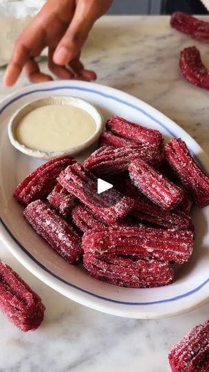 32K views · 647 reactions | Episode R of #AtoZOfDesserts, a series where every letter unfolds a new delight 🥰
R for - Red Velvet Churros💁🏻‍♂️ Taking my love for churros to the next level with these crispy and delicious red velvet-flavoured delights 🥰Super easy to make, this eggless dessert makes for the perfect choice for all your weekend cravings🤌🏻

Ingredients:
❤️1 cup water 
❤️3 tbsp butter (40grams)
❤️2 tbsp sugar
❤️1 cup all-purpose flour
❤️1/2 tbsp cocoa powder 
❤️1 tsp red food colour 

Method:
1. In a saucepan set over medium heat add water,butter ,sugar and cook it till the butter melts completely and water comes to a boil.
2. Reduce the heat and add all of the flour ,cocoa powder and red food colour in one go.
3. Mix everything and form it into a dough.Let the dough cool an Eggless Churros, Weekend Desserts, Desserts Red Velvet, Eggless Baking Recipes, Bake With Shivesh, Eggless Desserts, Eggless Baking, Baking Recipes Desserts, Red Food