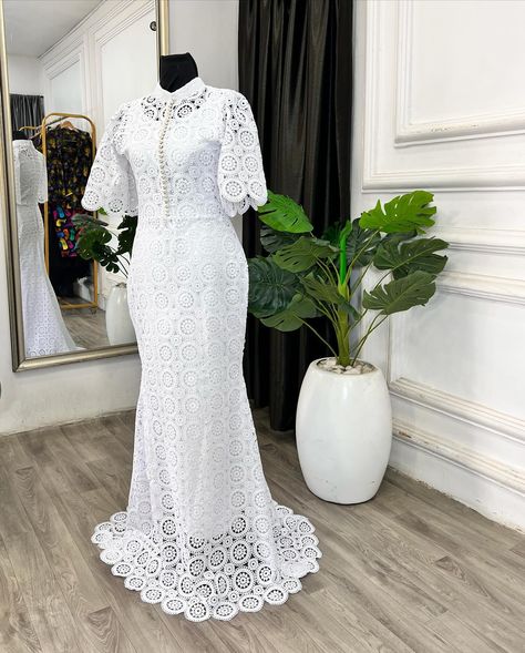 Dainty and delicate! This understated yet stunning bespoke dress for the Teramarg woman embodies soft femininity. Featuring a white cord lace fishtail design with a bishop collar, adorned with pearl buttons down the center bodice and bell sleeves. Perfect for making an elegant statement. Reach us on⬇️ ✅Click on the link on our bio to chat with us on WhatsApp ✅Send us a dm ✅Call us on 08103672667 ——————————————————— . . . . . . . . . . . . . . . . . . . . . . . . . #ankaradress #pre... White African Lace Styles, Cord Lace Styles For Women, Cord Lace Styles, Bishop Collar, Bespoke Dress, African Lace Styles, Lace Designs, Cord Lace, Lace Styles