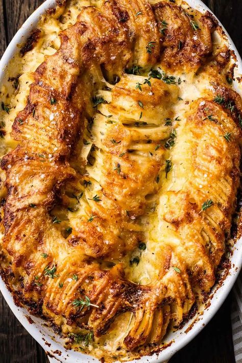 Cheesy Hasselback Potato Gratin | So Much Food Hasselback Gratin Potatoes, Cheesy Hasselback Potato Gratin, Cheesy Hassle Back Potatoes, Hasselback Scalloped Potatoes, Potato Side Dishes For Steak, Cheesy Hasselback Potatoes, Recipes Potatoes, Potato Gratin Recipe, Weeknight Dinner Recipes