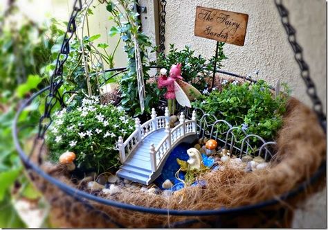 Lili of the Valley � Fluttering Gift Box. Fairy garden in a hanging basket Hanging Fairy Garden, Fairy Garden Box, Whimsical Fairy Garden, Miniature Garden Ideas, Indoor Fairy Gardens, Tiny Gardens, Garden Party Theme, Garden Water Feature, Fairies Garden