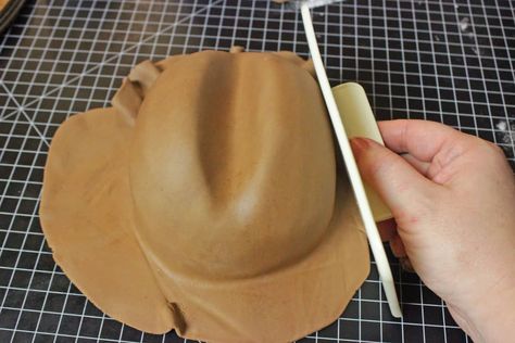 Cowboy Hat Cake Tutorial - Part 2 • Cake Journal Fondant Cowboy Hat, Make A Cowboy Hat, Cowboy Hat Cake, Cowboy Birthday Cakes, Fondant Smoother, Cowboy Cakes, Hat Cake, Cowboy Birthday Party, Hat Tutorial