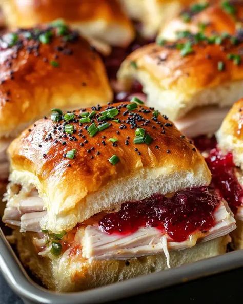 Savory turkey sliders with gooey cheese, tangy cranberry sauce, and soft rolls—a perfect snack for holiday gatherings or casual parties. Cranberry Sliders, Sliders Recipes Turkey, Cranberry Turkey, Turkey Sliders, Deli Turkey, Crowd Pleasing Recipes, Havarti, Hawaiian Rolls, Slider Recipes