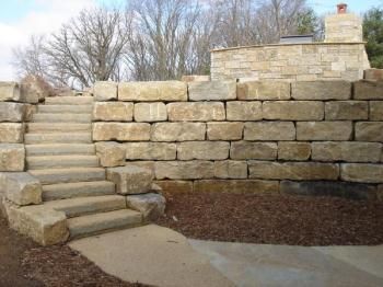 Large Block Limestone Retaining Wall Large Block Retaining Wall, Large Stone Retaining Wall, Large Retaining Wall Ideas Hillside, Limestone Block Retaining Wall, Limestone Retaining Wall Ideas, Retaining Wall Steps, Backyard Retaining Walls, Landscape Stairs, Garden Retaining Wall