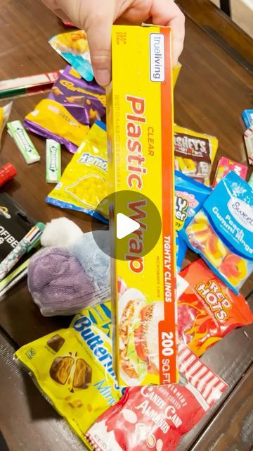 Auntie Coo Coo on YouTube on Instagram: "Saran Ball Game in less than 60 seconds⏱️ This is perfect for anyone Clearance Shopping after Christmas, and perfect family friendly fun for New Year’s Eve Parties! Grab some Saran Wrap, Pot Holders, Dice and Goodies and play the game that everyone wins!   #saran #saranball  #saranwrap  #saranwrapgame  #plasticwrap  #minutetowinit  #partygames  #familyfriendly  #newyearseve  #game  #greed  #dollartree  #dollargeneral  #lastminutegifts  #lastminute  #clearanceshopping  #holidayparty" Christmas Games For Family Saran Wrap, Christmas Game Saran Wrap Ball, Seran Wrap Christmas Ball, Cling Wrap Ball Game, Saran Wrap Ball Game Prizes Ideas Adults, Saran Wrap Ball Game Prizes Ideas, Saran Ball Game, Saran Wrap Christmas Game, Plastic Wrap Ball Game