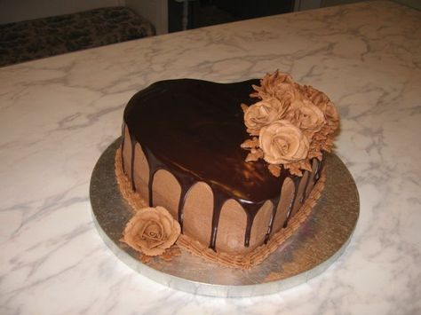 chocolate lovers dream - heart-shaped chocolate fudge cake filled with chocolate buttercream. first time using ganache. chocolate buttercream roses. Chocolate Heart Cake Decoration, Fudge Cake Filling, Choco Truffle Cake, Chocolate Heart Cakes, Heart Cake Design, Valentines Day Cake, Chocolate Truffle Cake, Chocolate Cake Designs, Buttercream Roses