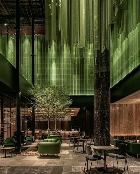 Vojtek Morsztyn on Instagram: "Restaurant in bloom 
.
.
Step into a dining experience like no other, where nature and design meet in perfect harmony. 🍃 This restaurant’s lush green hanging installations create an otherworldly atmosphere, seamlessly blending with the sleek black columns and rich wooden accents. 

Reflective surfaces capture every detail, making the space come alive with light and depth. The towering double-height ceilings provide an open, airy feel, while the intimate seating arrangements offer comfort and privacy.

#restaurant #interiorstyle #hotel #restaurantinterior #diningtable #lushlife #greenerydecor #spaday #hotelboutique #aiarchitecture
#architecturephotography #interiorgreen #hoteldesign
#interior #aiartist #interiordesigner
#designisinthedetails #interior #hotela Black Columns, Green Restaurant, Instagram Restaurant, Green Hotel, Greens Restaurant, Lobby Furniture, Hotel Inspiration, Arch Architecture, Greenery Decor