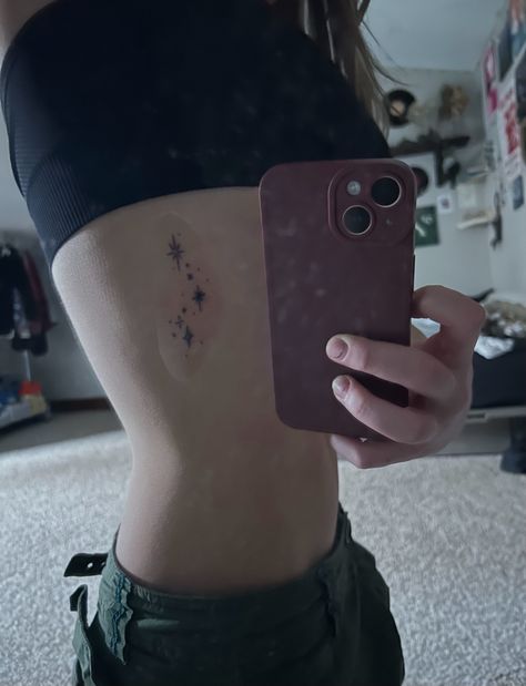 sparkle tattoo, dainty tattoo, tattoo for girls, small tattoos, rib tattoo Dainty Girl Tattoos, Constellation Rib Tattoo, Star Tattoo Ribcage, Small Side Tattoos Women Ribs, Stars Rib Tattoo, Star Rib Tattoo, Small Ribcage Tattoo, Dainty Rib Tattoos, Ribs Tattoo For Women