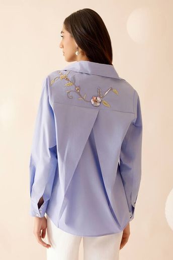 Blue shirt featuring hand-embroidered floral motif with cross-over detailing in the back. - Aza Fashions Coordinated Sets, Fancy Suit, Pink Tree, Trendy Shirt Designs, Iranian Women Fashion, Embroidered Napkins, Dress Design Patterns, White Shirts Women, Embroidery Suits Design