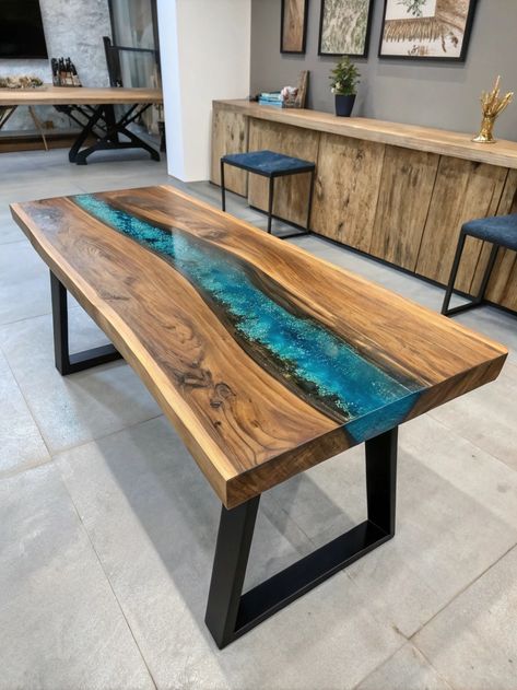 Check out this stunning modern table featuring a vibrant river-like epoxy resin inlay that mimics flowing water. 
The industrial metal base perfectly complements its unique design! 

What do you think of this refreshing piece? Share your thoughts and tag a friend who loves woodwork!
.
#woodworking #wood #handmade #woodworker #woodwork #diy #design #smallbusiness #interiordesign #woodart #art #homedecor #furniture #wooddesign #carpentry #woodcraft Table Top Designs, Resin Inlay, Woodwork Diy, Flowing Water, River Table, Woodworking Wood, Industrial Metal, Tag A Friend, Table Tops