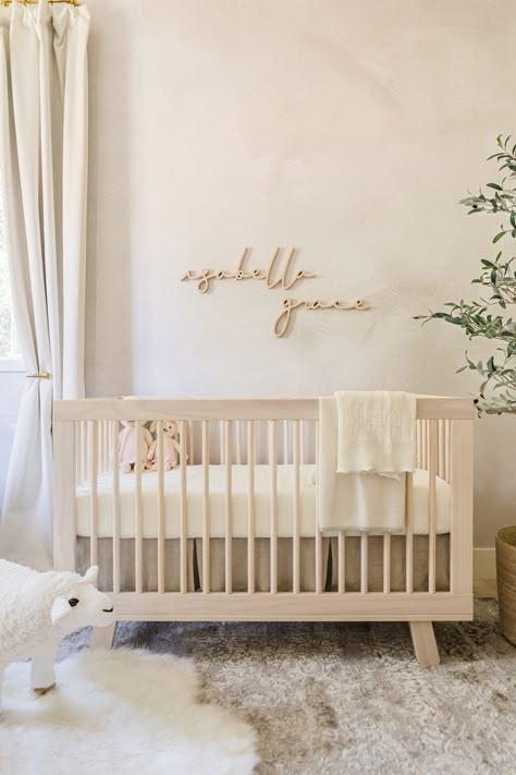 Our Baby Girl’s Nursery Tour – Jessi Malay Nursery Room Simple, Off Center Crib Nursery, Neutral Tones Nursery, Light Neutral Nursery, Modern Nursery Accent Wall, Nursery Ideas Baby Girl, Baby Girl Nursery Inspiration, Nursery Inspo Girl, Limewash Nursery