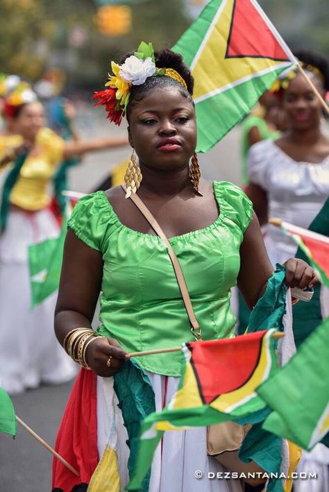 Proud Guyanese woman, Guyana flag. Guyanese Culture, Georgetown Guyana, Grenada Caribbean, Guyana Flag, Caribbean Outfits, British Guiana, Folk Culture, World Thinking Day, Cultures Of The World