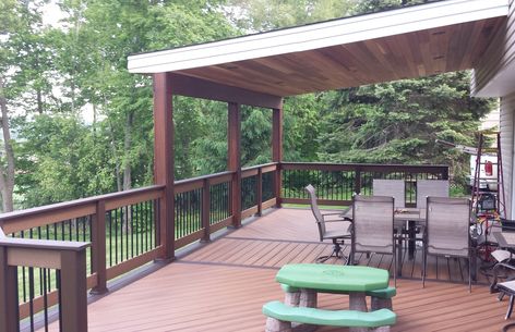 Roof Covered Structure Photos - Mercury Decks Partial Roof Over Deck, Roof On Deck Ideas, Porch Tied Into Roof, Deck Ideas With Covered Area, Add Deck To Front Of House, Decks With Roof Ideas, Second Floor Covered Deck, Deck Overhang Roof, Deck With Overhang