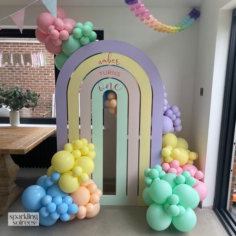 Pastel Rainbow 1st Birthday Party! Rainbow Sailboard + Personalisation and Pastel Rainbow Balloon Garland #balloongarland #balloonbackdrop #1stbirthday #1stbirthdayideas #1stbirthdayparty #pastelrainbow #rainbowdecor #rainbowparty Pastel Rainbow 1st Birthday Party, Rainbow Arch Backdrop, Pastel Rainbow 1st Birthday, Rainbow 1st Birthday Party, Pastel Balloon Garland, Rainbow Balloon Garland, Diy Backdrop Stand, Rainbow 1st Birthday, Balloon Colors