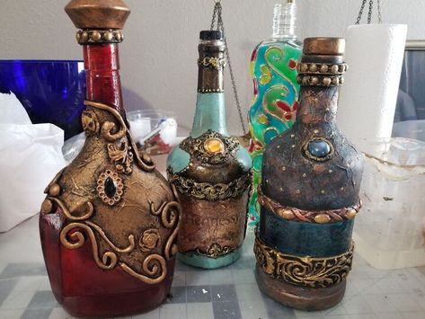 Liquor Bottle Decorating | Hometalk Old Liquor Bottles, Empty Liquor Bottles, Alcohol Bottle Crafts, Liquor Bottle Crafts, Black Chalk Paint, Recycled Glass Bottles, Elmer's Glue, Alcohol Bottles, Gold Spray Paint